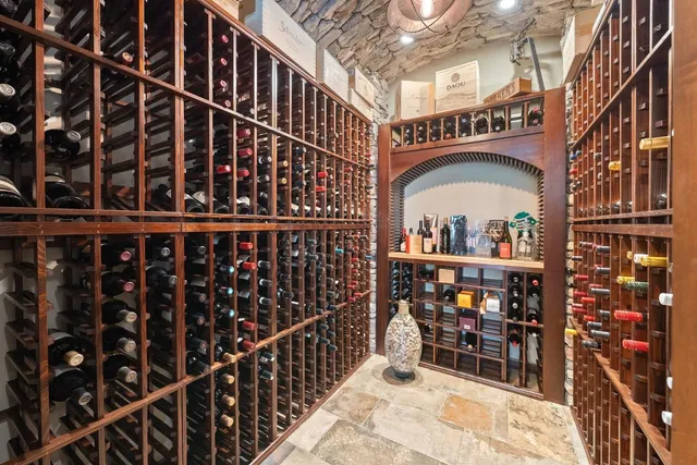 a view of a patio with couches table and chairs and potted plants