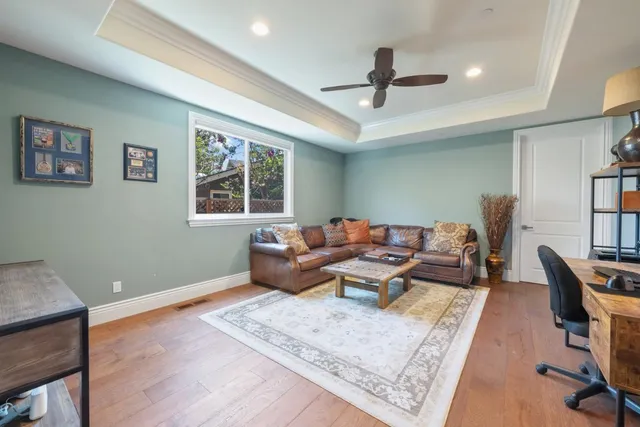 a view of backyard with outdoor seating and green space