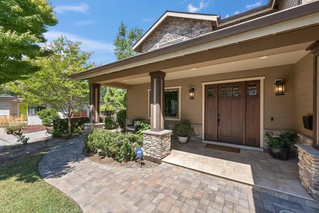a dining room with furniture window and wooden floor
