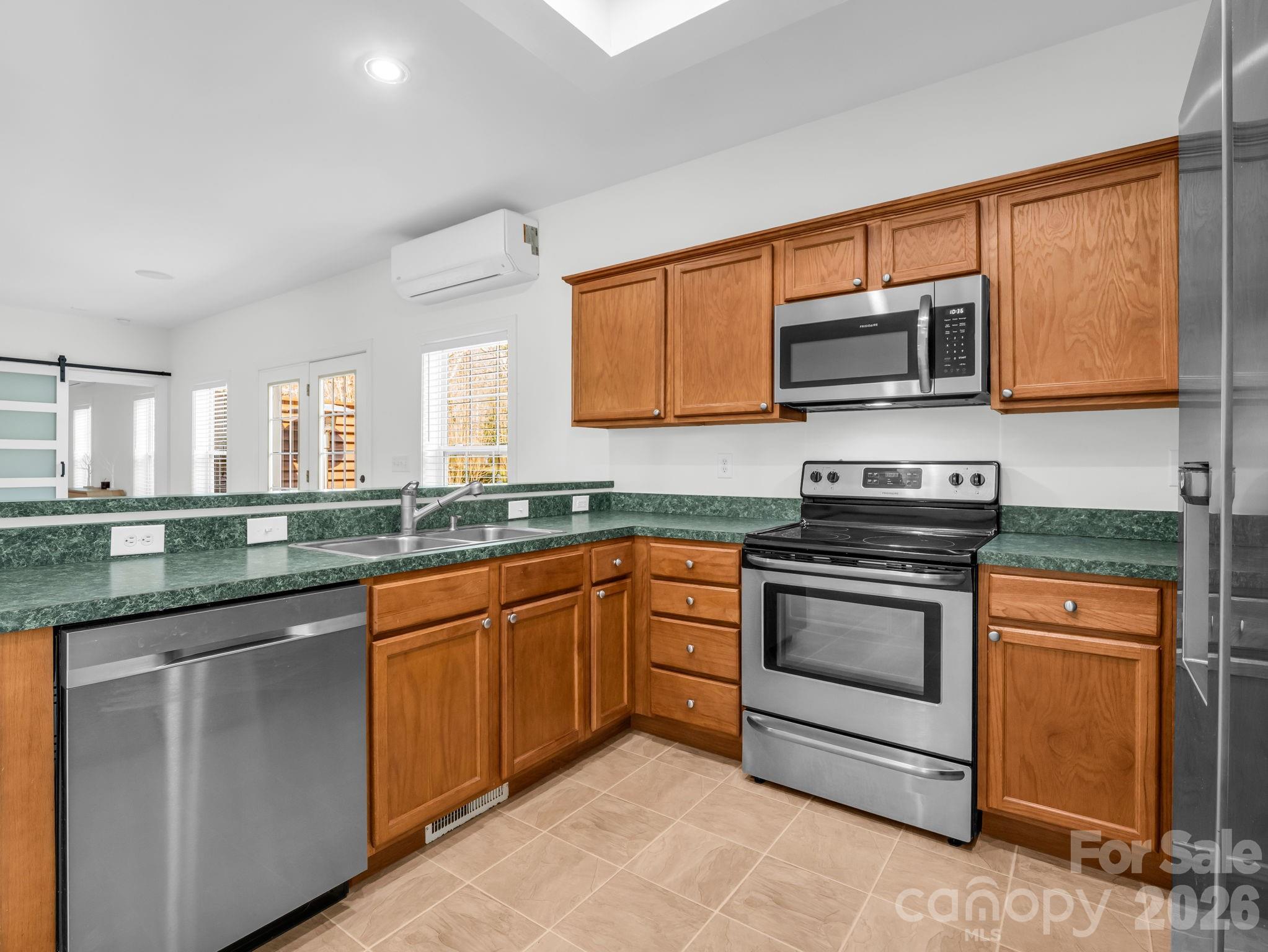 19 Lynnbrook Way Columbus, NC 28722 - Photo 15 of 45 a kitchen with stainless steel appliances granite countertop a stove microwave and sink