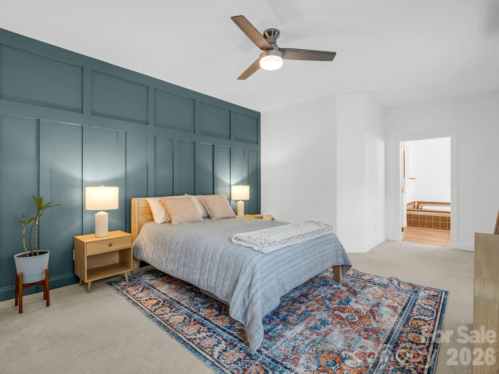 19 Lynnbrook Way Columbus, NC 28722 - Photo 19 of 45 a bedroom with bed and a chandelier