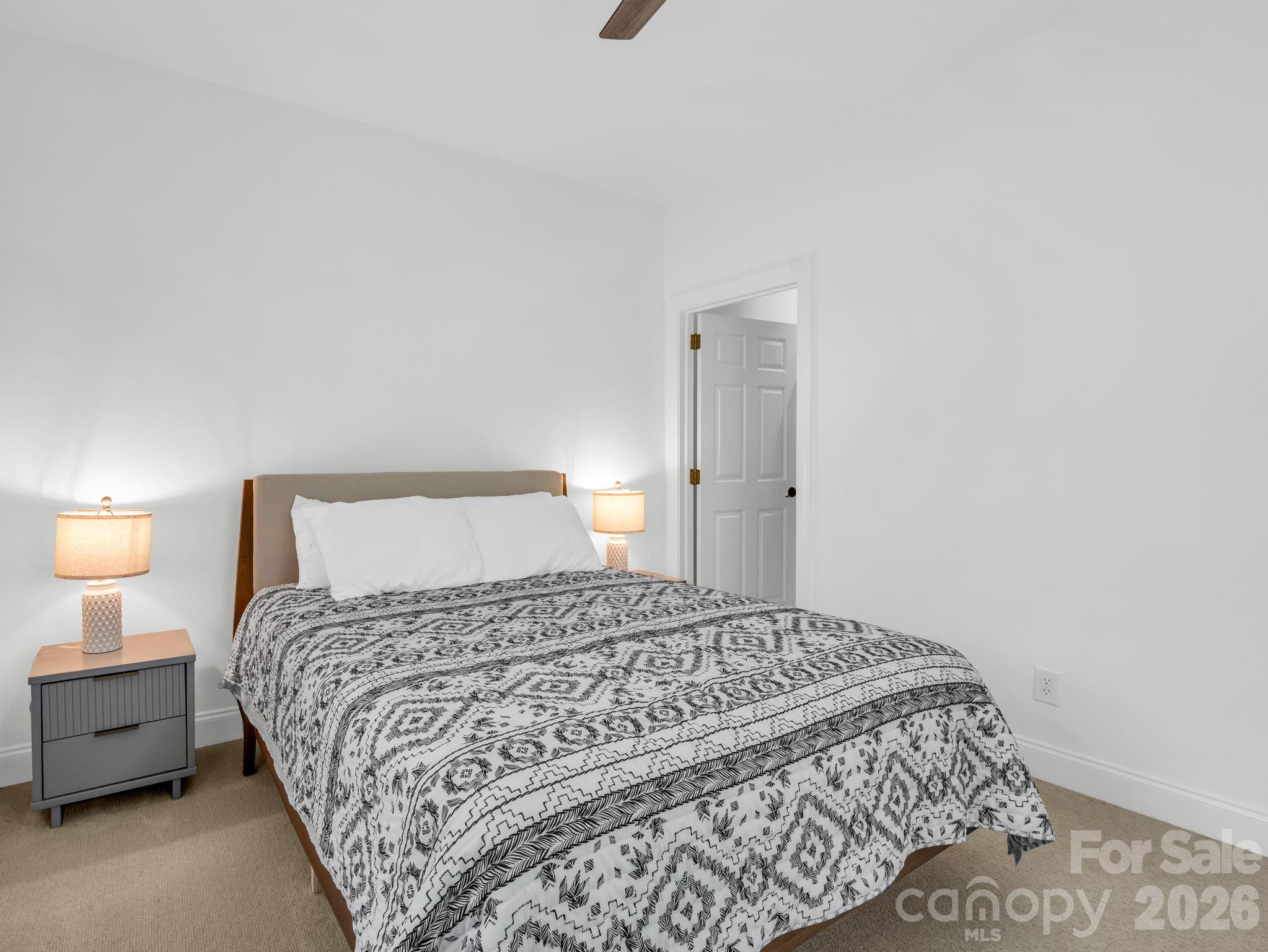 19 Lynnbrook Way Columbus, NC 28722 - Photo 26 of 45 a bedroom with a bed and a lamp