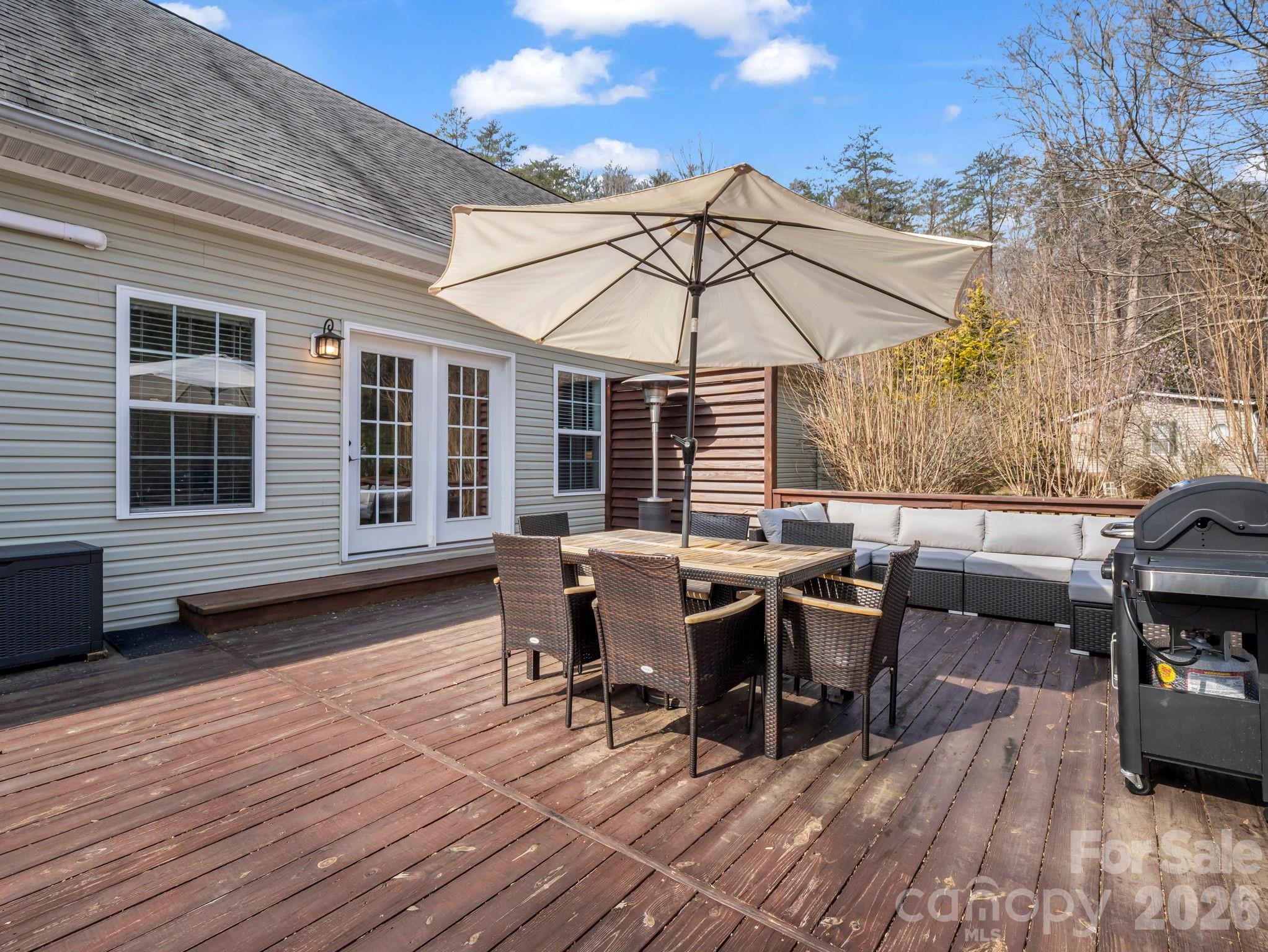 19 Lynnbrook Way Columbus, NC 28722 - Photo 38 of 45 a view of a dinning table and chairs in patio of the house