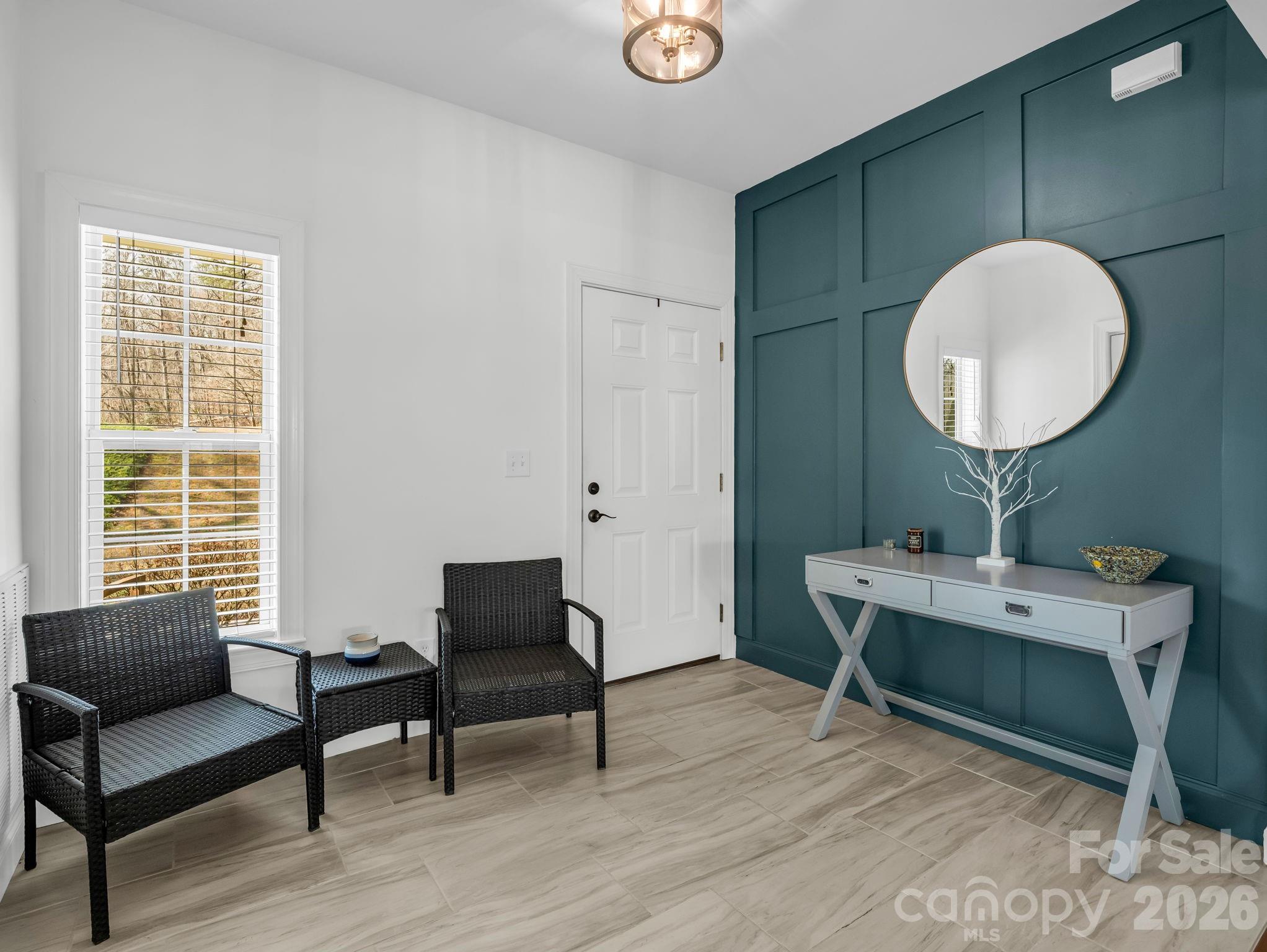 19 Lynnbrook Way Columbus, NC 28722 - Photo 6 of 45 a living room with furniture a window and a potted plant