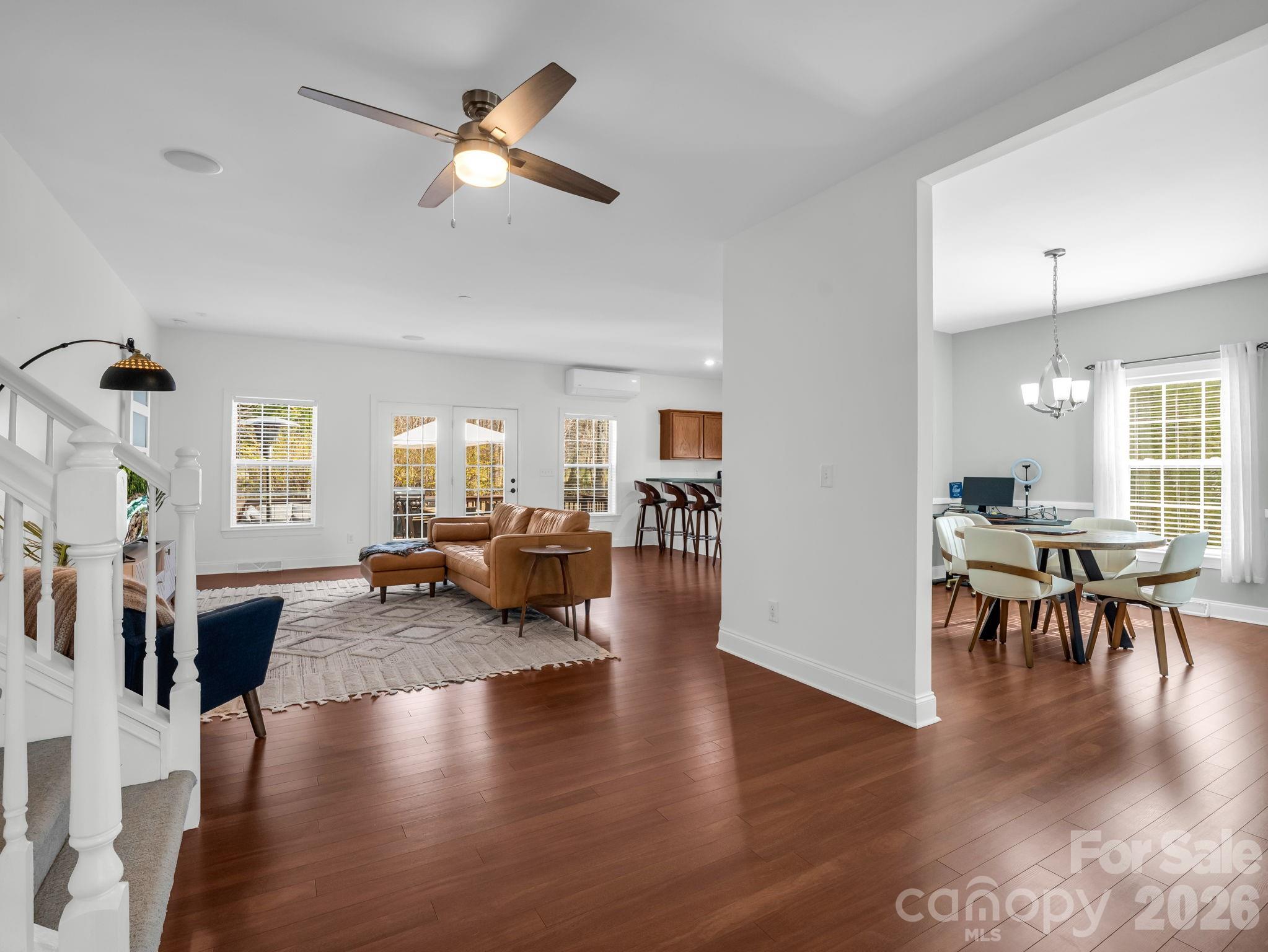 19 Lynnbrook Way Columbus, NC 28722 - Photo 7 of 45 a living room with furniture dining table and wooden floor