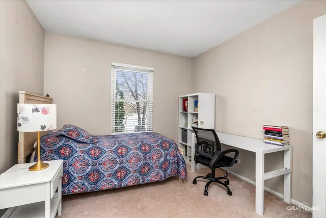 a bedroom with a workspace