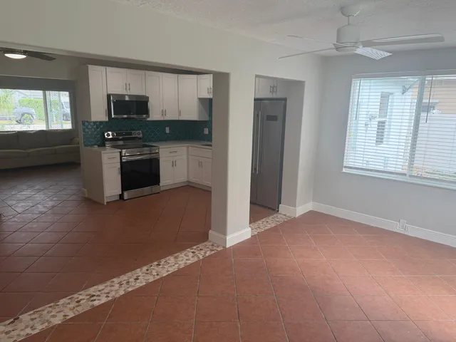 a view of a room that has a large window