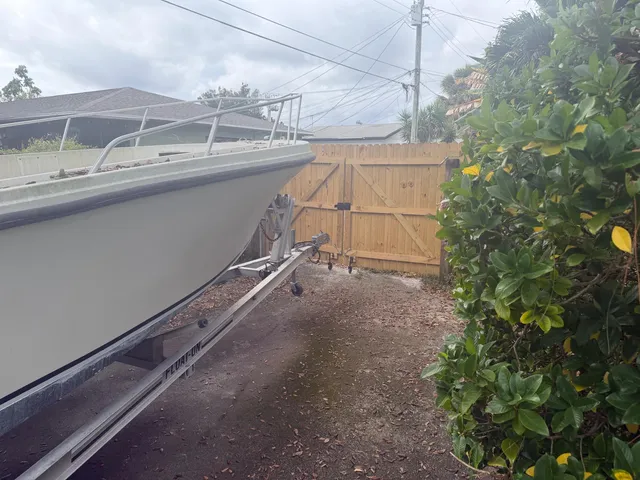 a view of a street that has parked cars