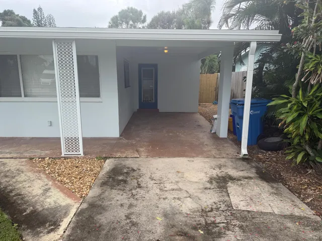 a view of a house with a snow in the yard