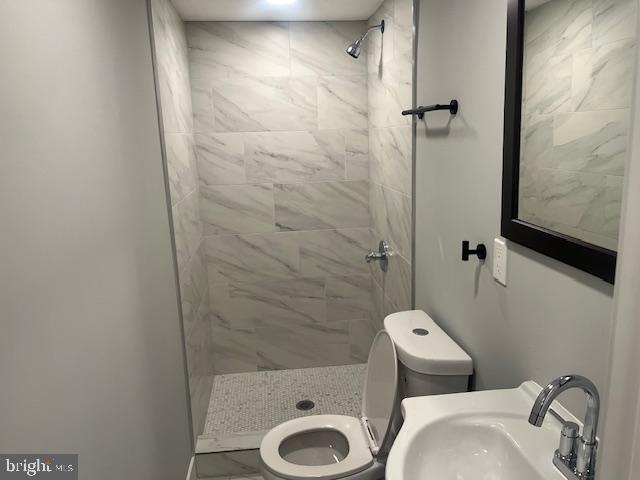 6339 Morton Street, Unit G Philadelphia, PA 19144 - Photo 7 of 10 a bathroom with a sink and a toilet