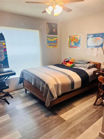 a bedroom with a bed and dresser