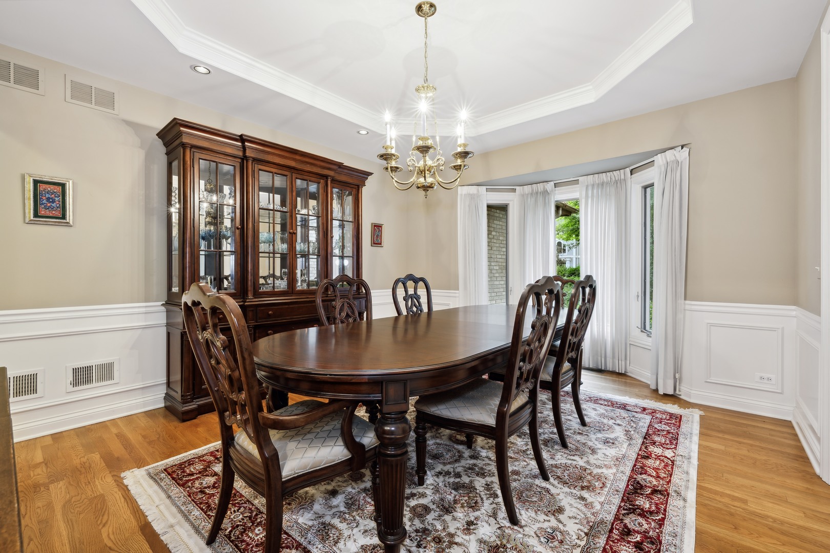 310 Belle Foret Drive Lake Bluff, IL 60044 - Photo 15 of 31 a view of a a dining room with furniture window and wooden floor