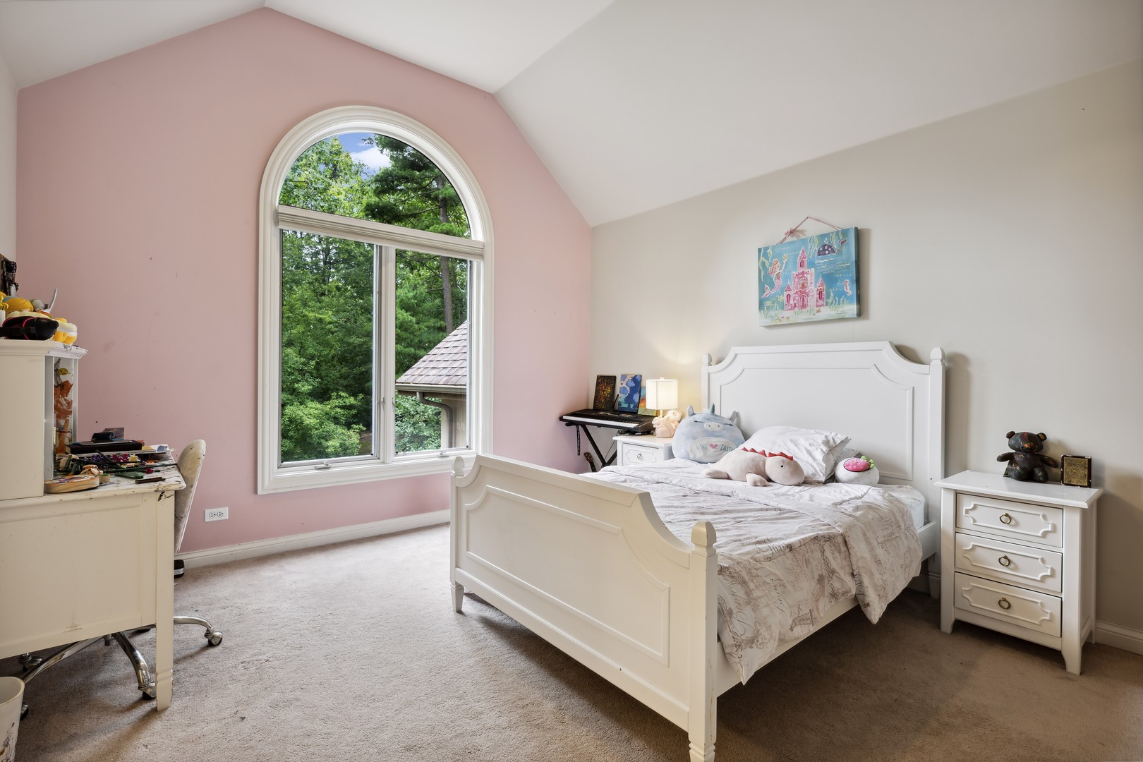 310 Belle Foret Drive Lake Bluff, IL 60044 - Photo 24 of 31 a bedroom with a bed a large window and a chandelier