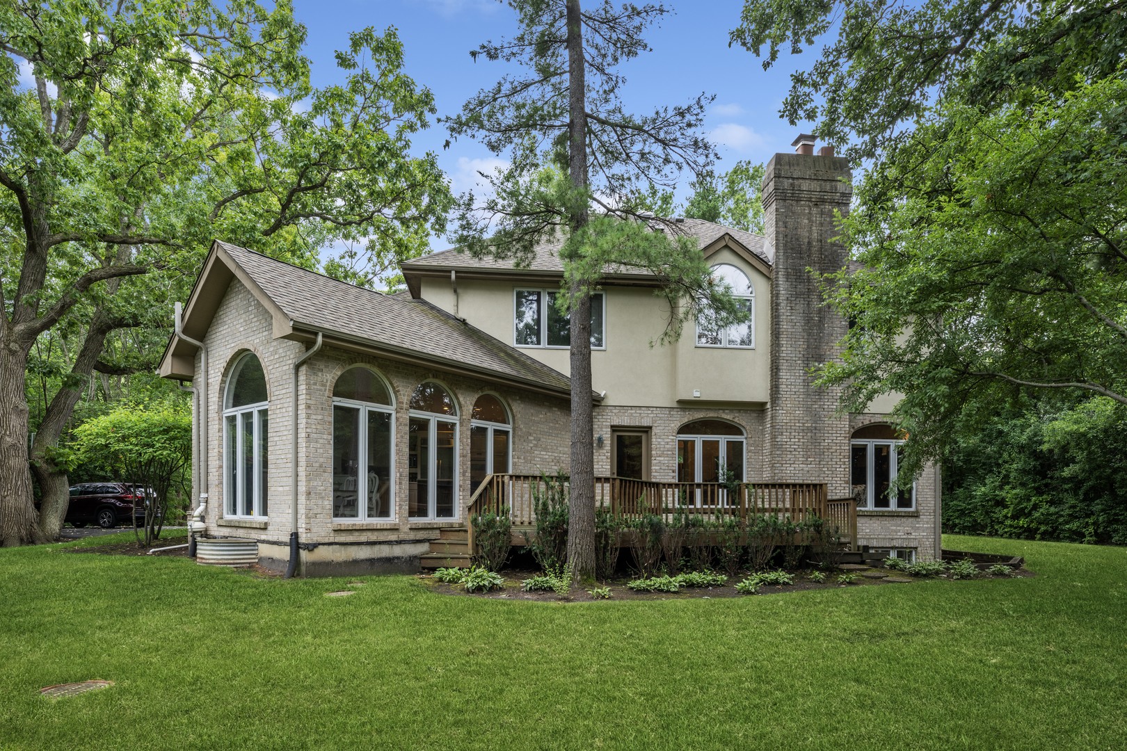 310 Belle Foret Drive Lake Bluff, IL 60044 - Photo 4 of 31 a white house that has a tree in front of it