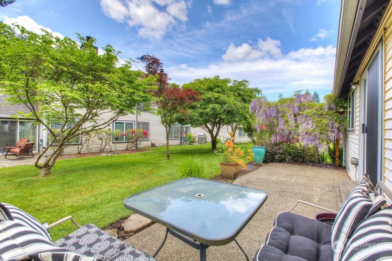 32911 4th Lane South Federal Way, WA 98003 - Photo 18 of 19 a view of a backyard with furniture and garden