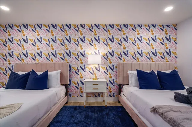 a bedroom with a bed and a chair