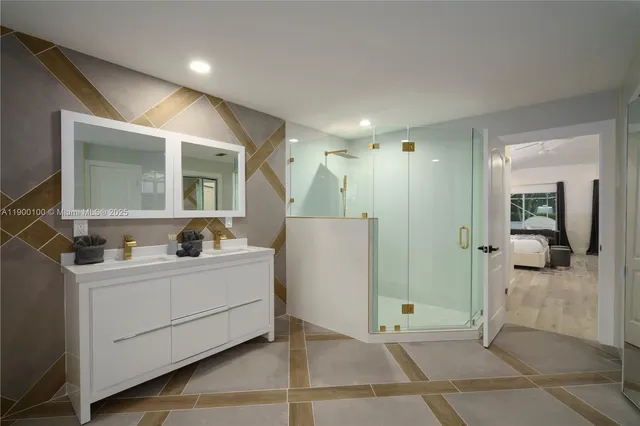 a bathroom with a double vanity sink mirror and shower