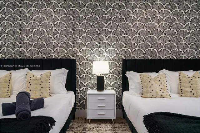 a bedroom with a bed and a chair