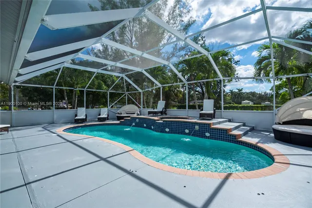 a view of a backyard with sitting area