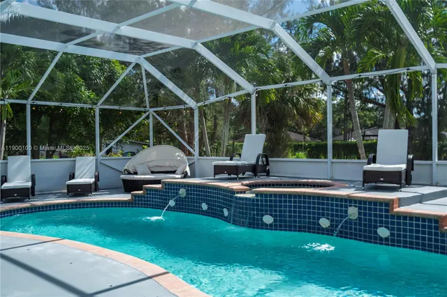 a view of a chair and table in the garden
