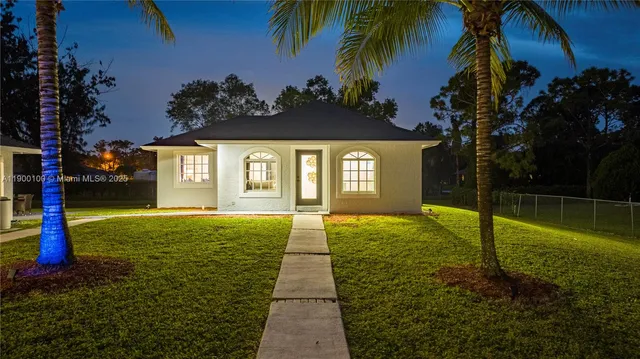 a view of a swimming pool with a garden