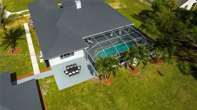 a view of a house with a swimming pool