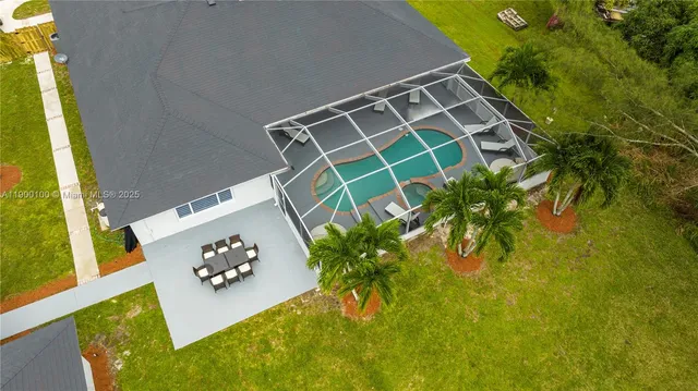 a front view of a house with swimming pool