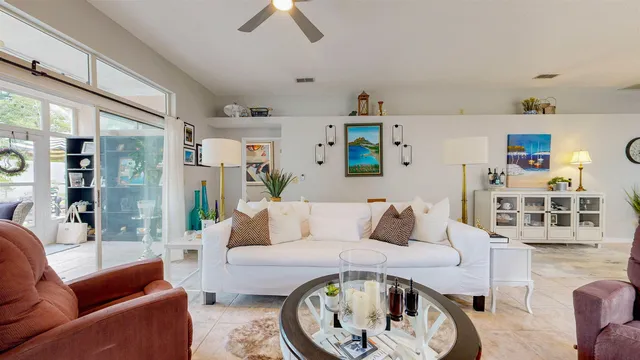 a bedroom with a large bed and a couch