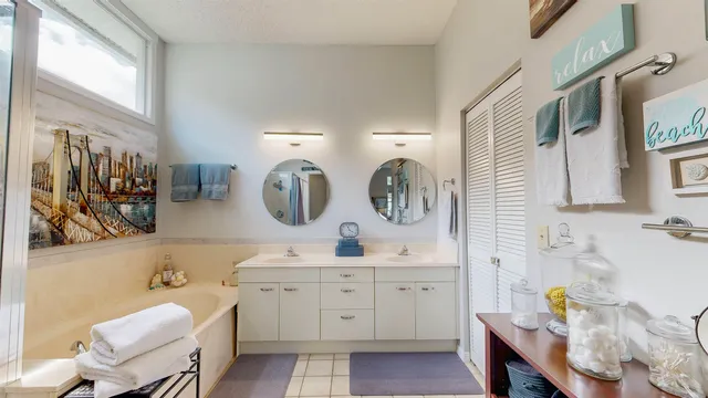 a living room with furniture a rug and a large window