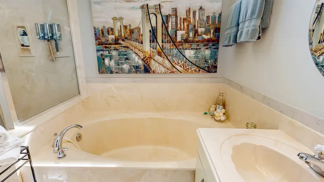 a patio with a table and chairs and potted plants