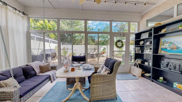 an aerial view of multiple houses with a yard