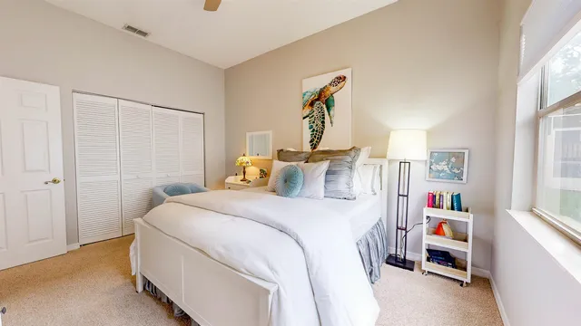 a room with furniture a workspace and a book shelf