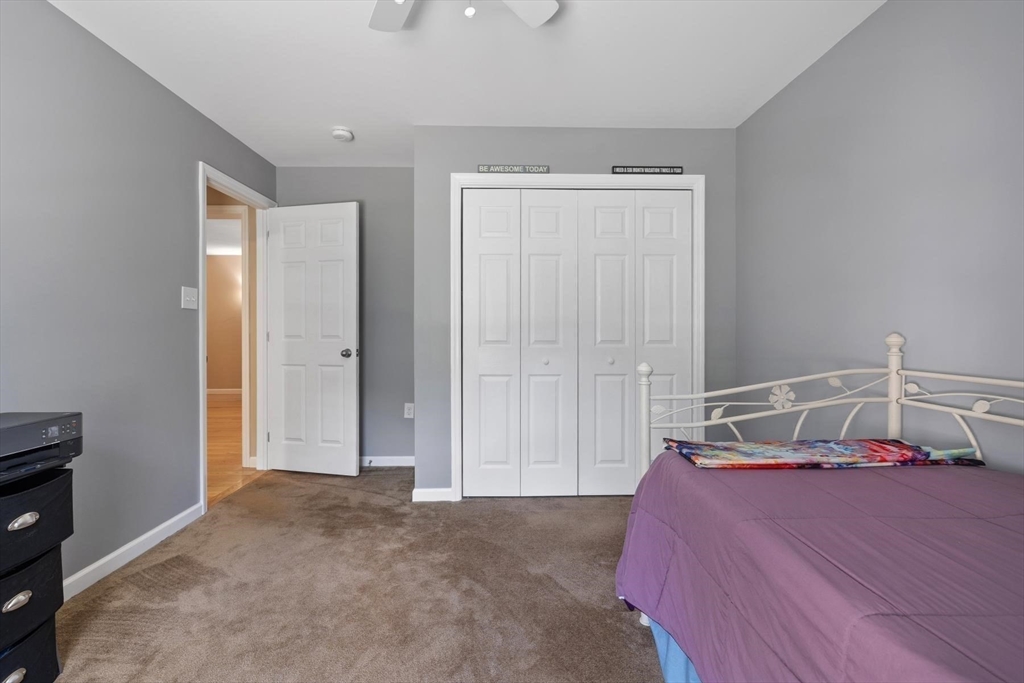 297 Manchaug Road Sutton, MA 01590 - Photo 15 of 40 a bedroom with a bed and a window