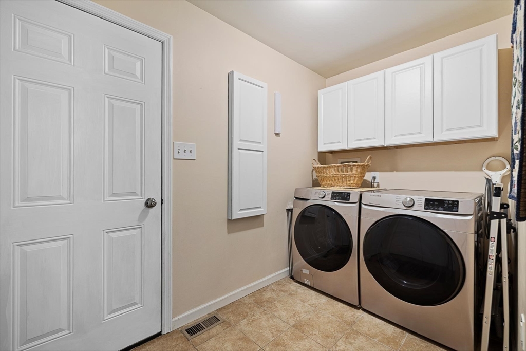 297 Manchaug Road Sutton, MA 01590 - Photo 18 of 40 a utility room with dryer and washer