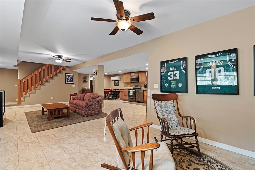 297 Manchaug Road Sutton, MA 01590 - Photo 23 of 40 a living room with furniture and a window