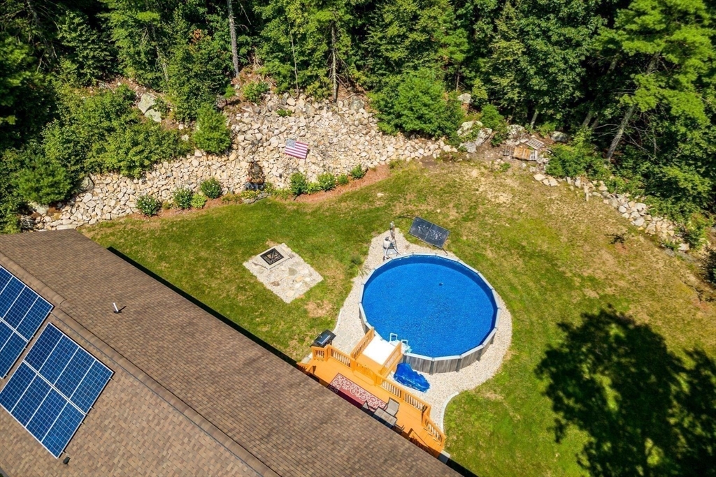 297 Manchaug Road Sutton, MA 01590 - Photo 32 of 40 a aerial view of a swimming pool