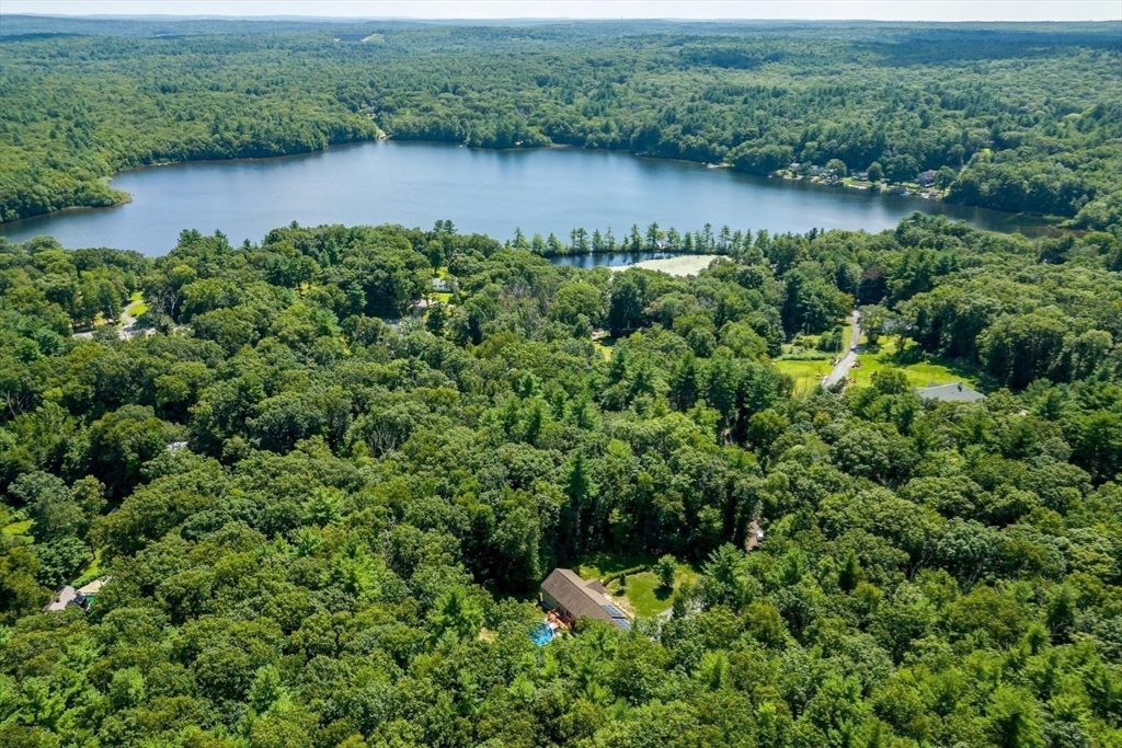 297 Manchaug Road Sutton, MA 01590 - Photo 34 of 40 an aerial view of a house with a yard and lake view