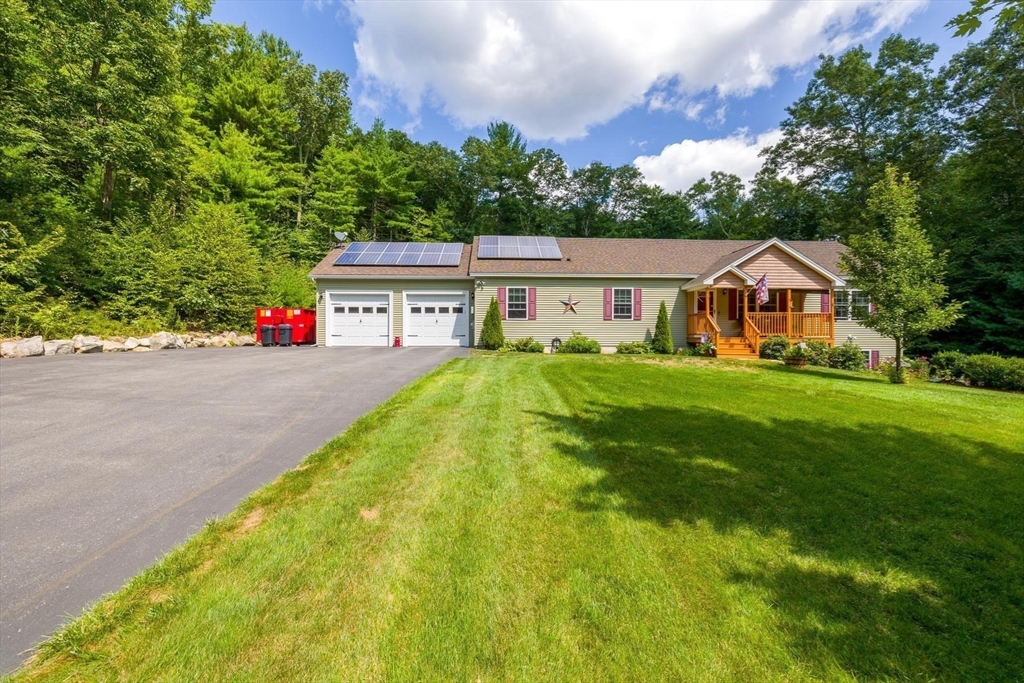 297 Manchaug Road Sutton, MA 01590 - Photo 4 of 40 a view of house with garden