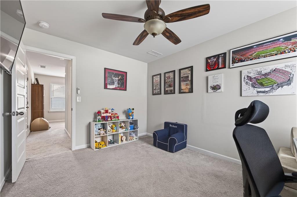 266 Shoals Bridge Road Acworth, GA 30102 - Photo 34 of 43 a bedroom with furniture and a chandelier
