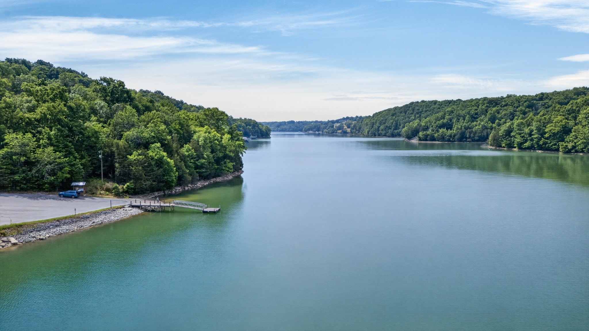 228 Shasteen Ridge Road Lynchburg, TN 37352 - Photo 53 of 53 a view of a lake with houses in the back
