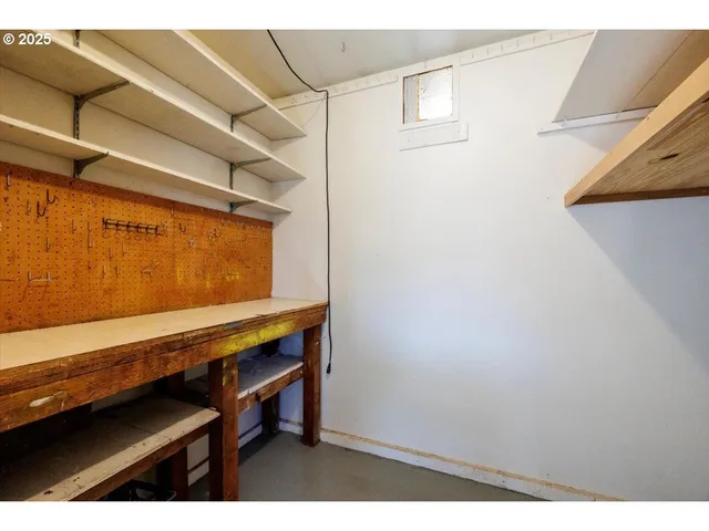 a view of room with racks on the wall