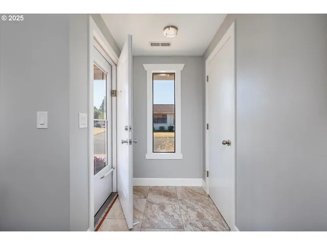 a view of an empty room and window