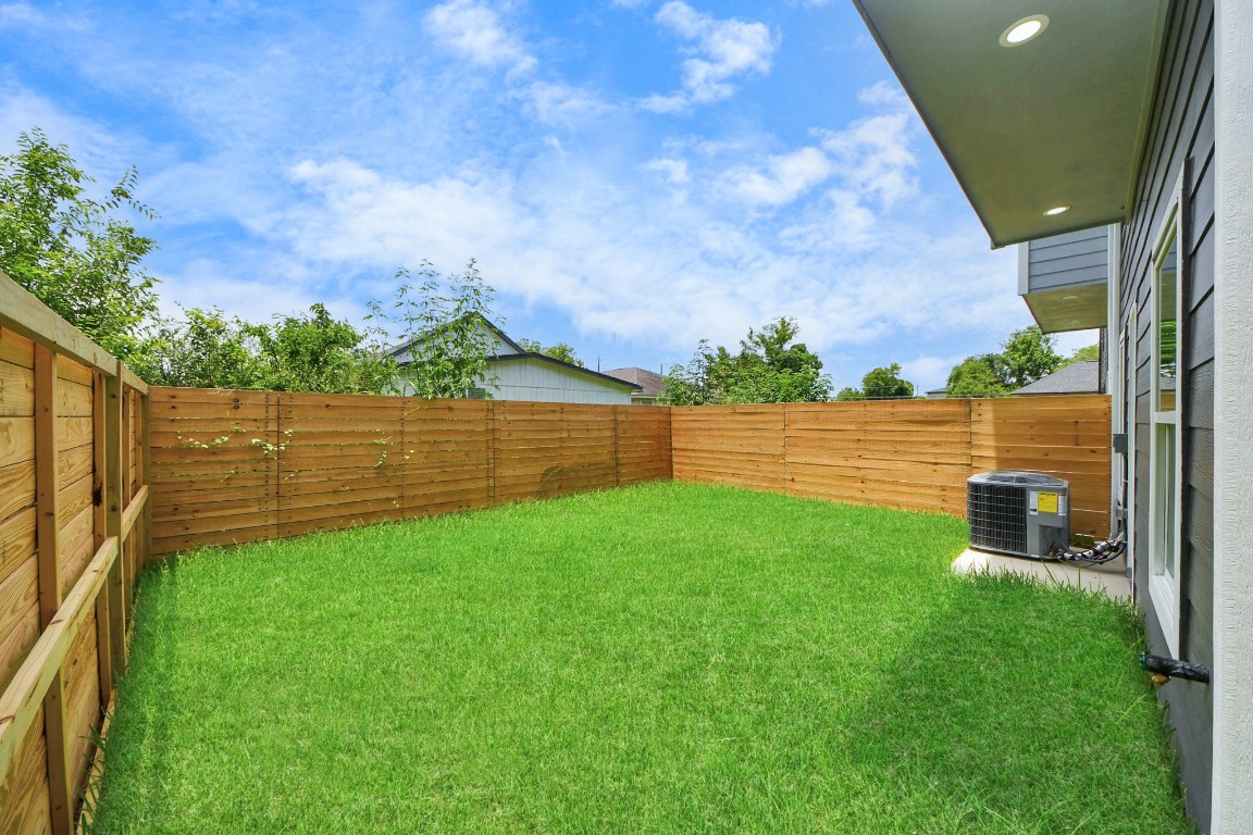 8312 Comal Street Houston, TX 77051 - Photo 15 of 17 a view of a backyard with wooden fence