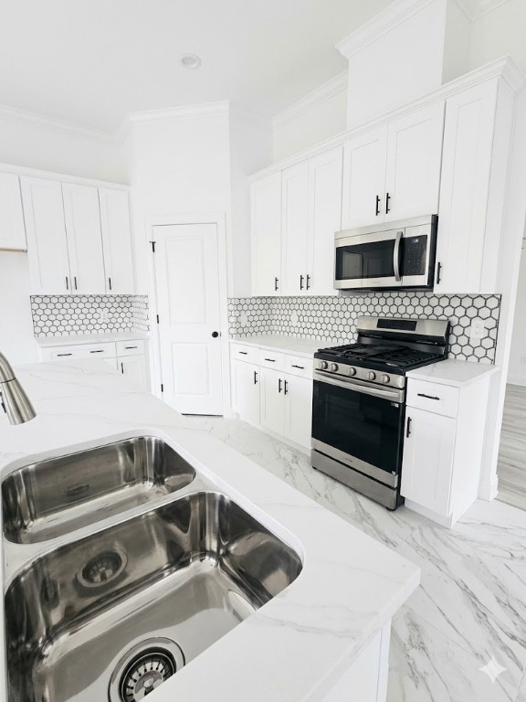 8312 Comal Street Houston, TX 77051 - Photo 4 of 17 a kitchen with a stove a sink and a white cabinets