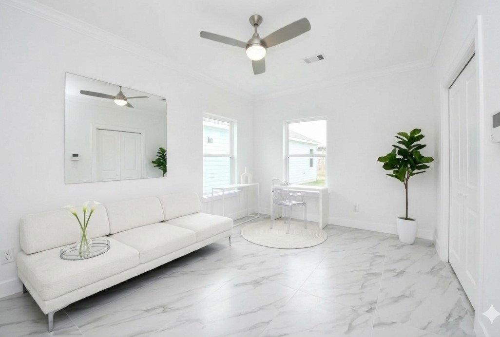 8312 Comal Street Houston, TX 77051 - Photo 9 of 17 a living room with furniture and a potted plant