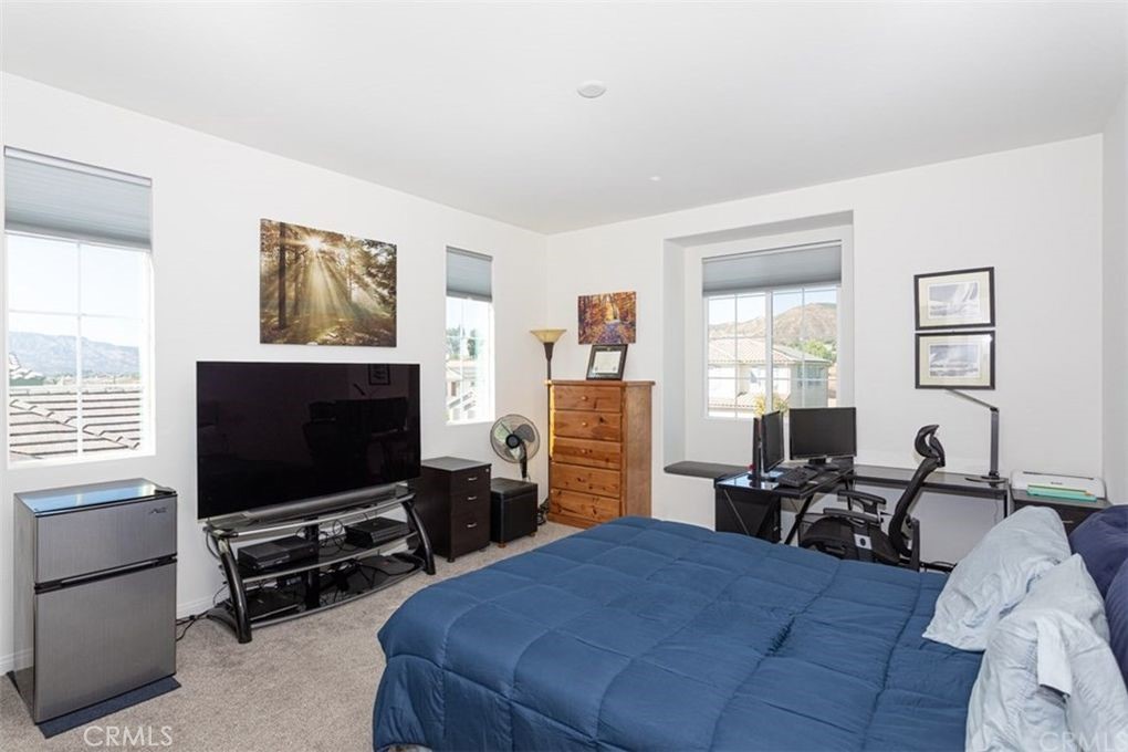 24125 Montecito Drive Wildomar, CA 92595 - Photo 13 of 25 a living room with furniture and a flat screen tv
