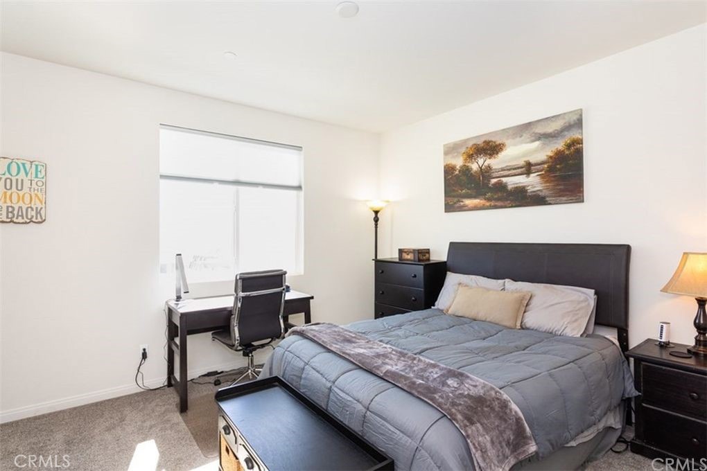 24125 Montecito Drive Wildomar, CA 92595 - Photo 14 of 25 a bedroom with a bed and a desk