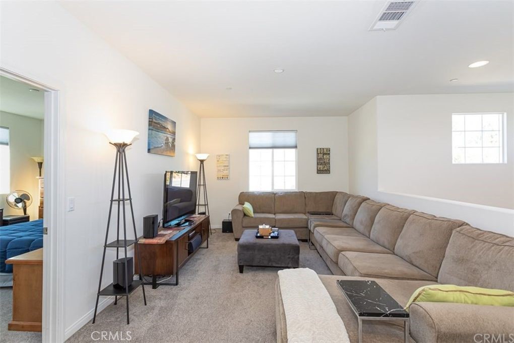 24125 Montecito Drive Wildomar, CA 92595 - Photo 17 of 25 a living room with furniture and a flat screen tv