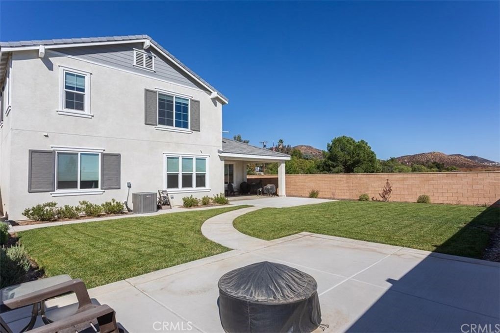 24125 Montecito Drive Wildomar, CA 92595 - Photo 20 of 25 a view of a house with a yard