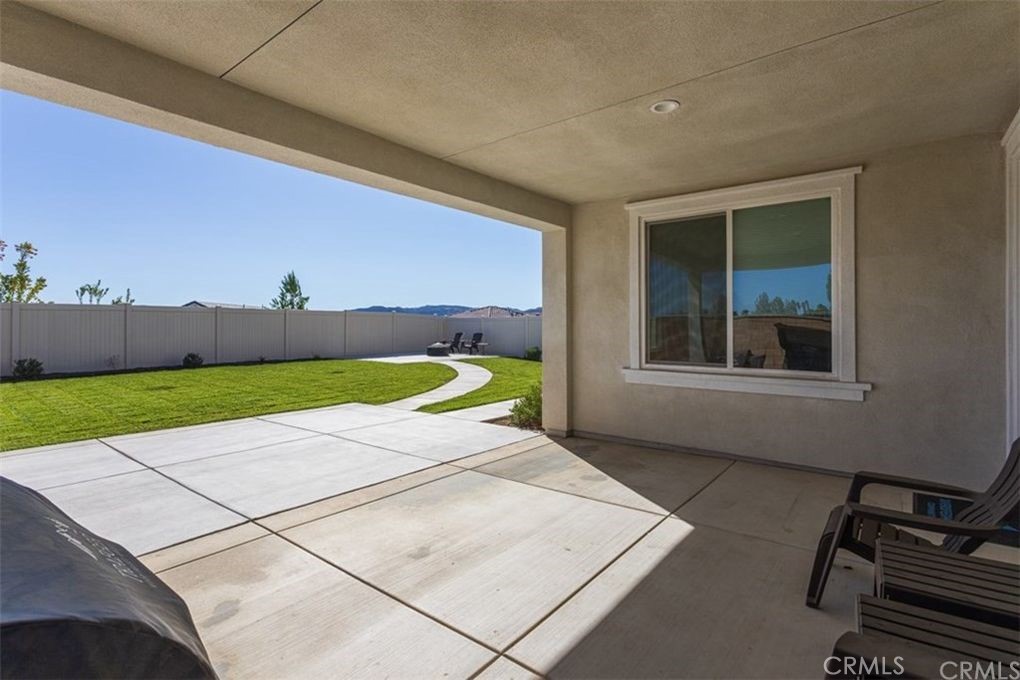 24125 Montecito Drive Wildomar, CA 92595 - Photo 22 of 25 a view of a room with a flat screen tv